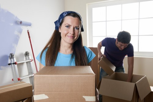 Packed household boxes and furniture ready for storage