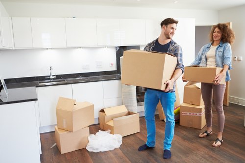 Packed moving boxes ready for transport in a Roehampton home