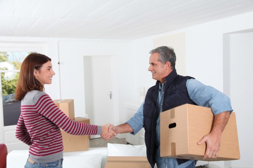 Customer moving sealed boxes into a secure storage unit