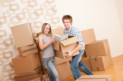 Removals workers handling stairs and access in a Roehampton apartment block